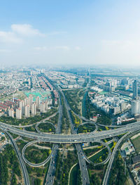 Aerial view of cityscape against sky