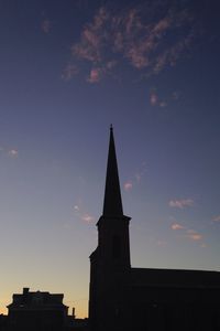 Low angle view of church against sky in city
