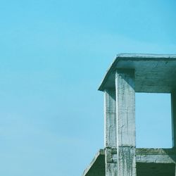 Low angle view of built structure against clear blue sky