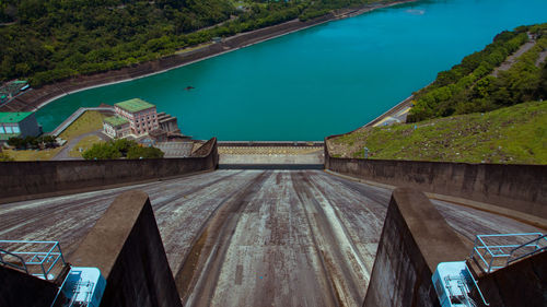 High angle view of swimming pool against blue sky