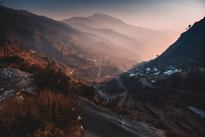 Scenic view of mountains against sky during sunset