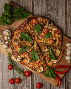 Directly above shot of pizza served on table