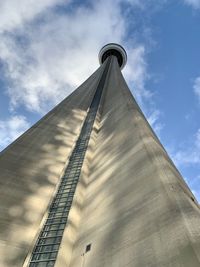 Low angle view of building against cloudy sky