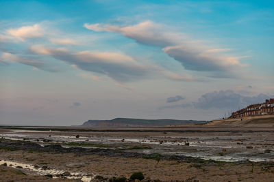 Scenic view of beach against sky during sunset