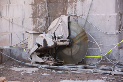 Abandoned boat against wall