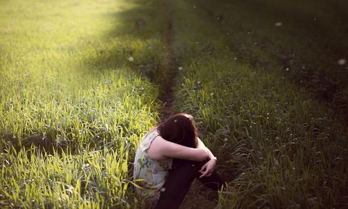 Man standing on grassy field