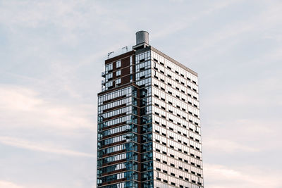 Low angle view of modern building against sky in city