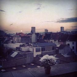 Buildings against cloudy sky