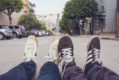 Low section of man and woman on street