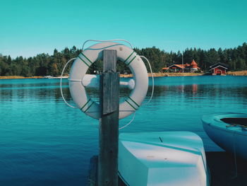 Boat in swimming pool against clear blue sky