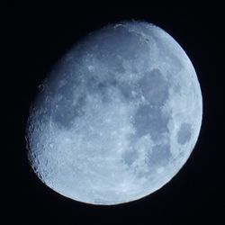 Low angle view of moon against sky at night