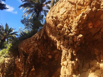 Low angle view of rock formation against sky