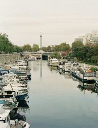 Boats moored at harbor