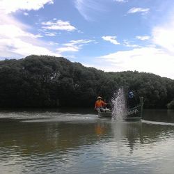 People in boat at sea