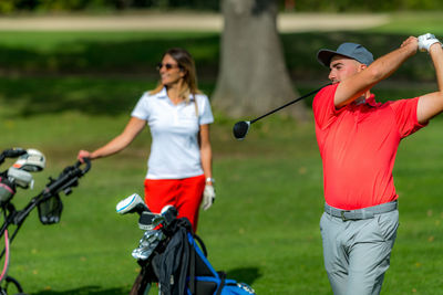 Happy golf couple on a golf course