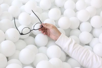 Directly above shot of person balls in container