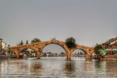 Bridge over river against clear sky