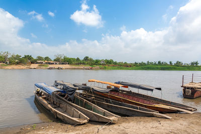 Boats moored in lake