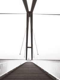 Empty footbridge leading to sea