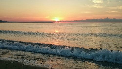 Scenic view of sea at sunset