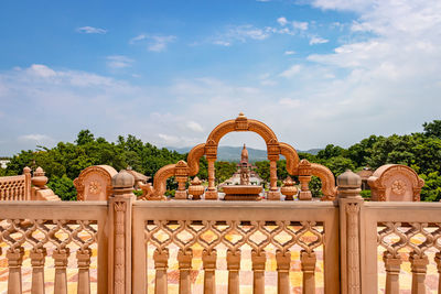 Unique red stone arc of jain temple with amazing natural landscape view at morning 