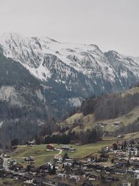 Aerial view of snowcapped mountains against sky