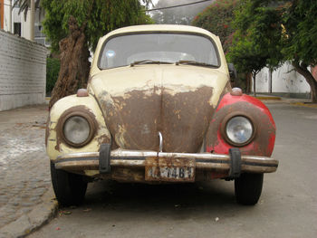 Abandoned vintage car on street