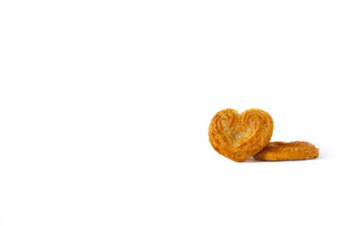 Close-up of heart shape over white background