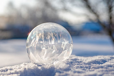 Close-up of bubbles against sky during winter