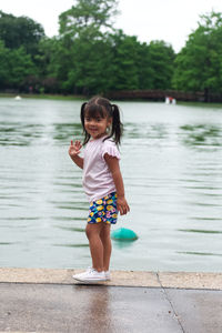 Full length of girl waving 