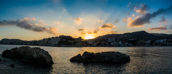 Panoramic view of sea against sky during sunset