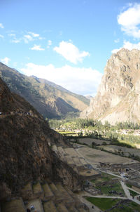 Scenic view of mountains against cloudy sky