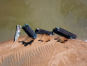 High angle view of abandoned piano on beach