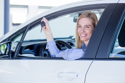 Close-up of woman sitting car