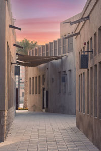 View of buildings in city at sunset