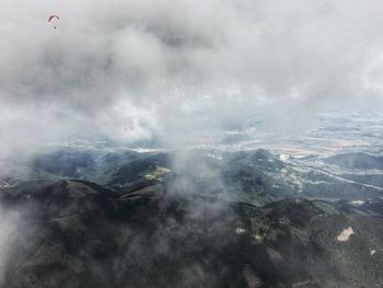 Aerial view of mountain range against sky