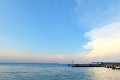 Scenic view of sea against blue sky