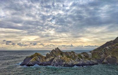 Scenic view of sea against sky at sunset