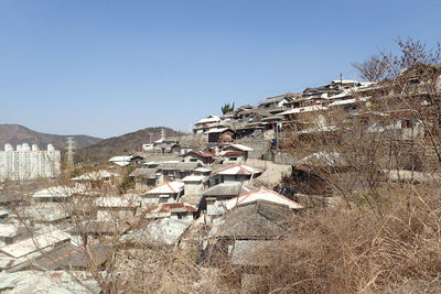 Town against clear sky