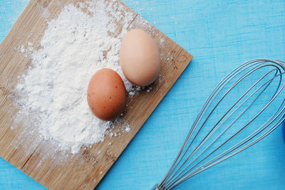 High angle view of eggs in container on table