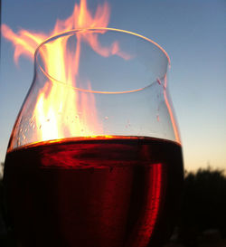 Close-up of beer glass against clear sky