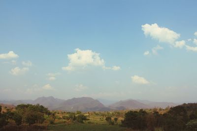 Scenic view of mountains against cloudy sky