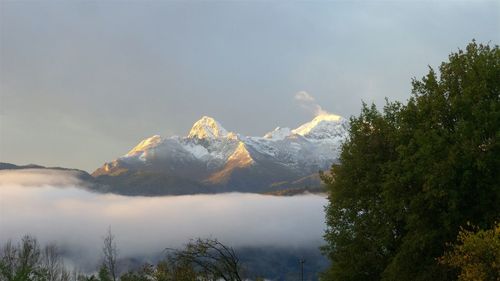 Scenic view of snowcapped mountains against sky