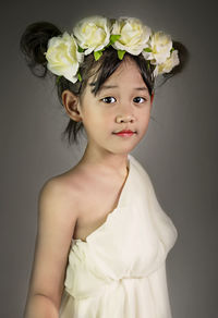 Portrait of a girl with red flower