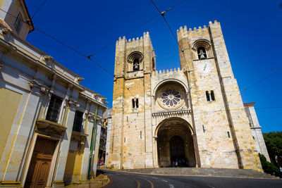 Low angle view of building against blue sky