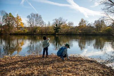 Boys playing at lakeshore