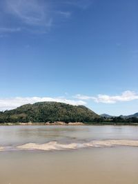 Scenic view of sea against blue sky