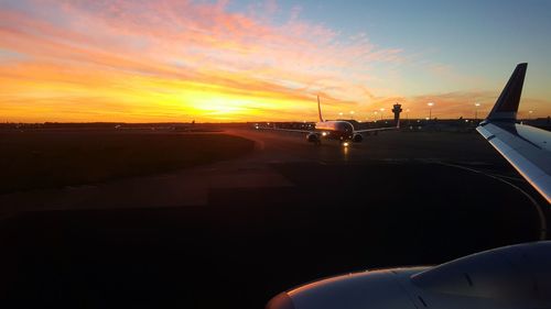 Close-up of car against sky during sunset