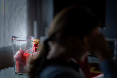 Midsection of woman drinking glass