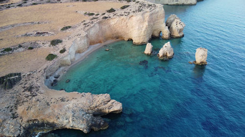 High angle view of rocks by sea